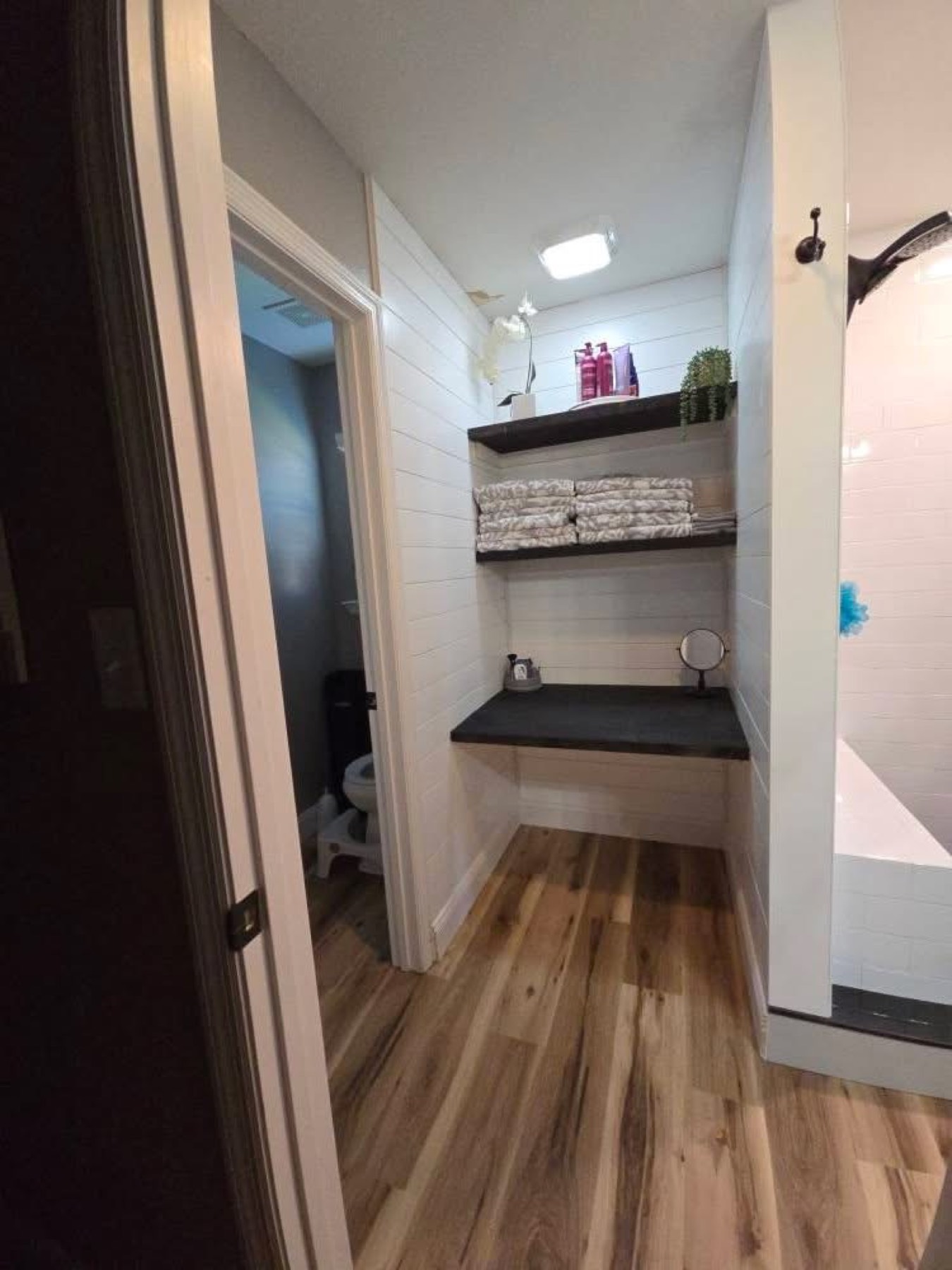 Towel nook with floating shelves