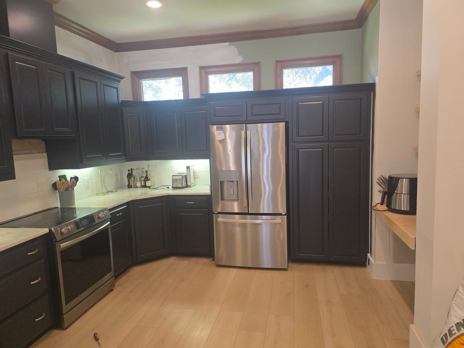 Charcoal cabinets, fridge wall