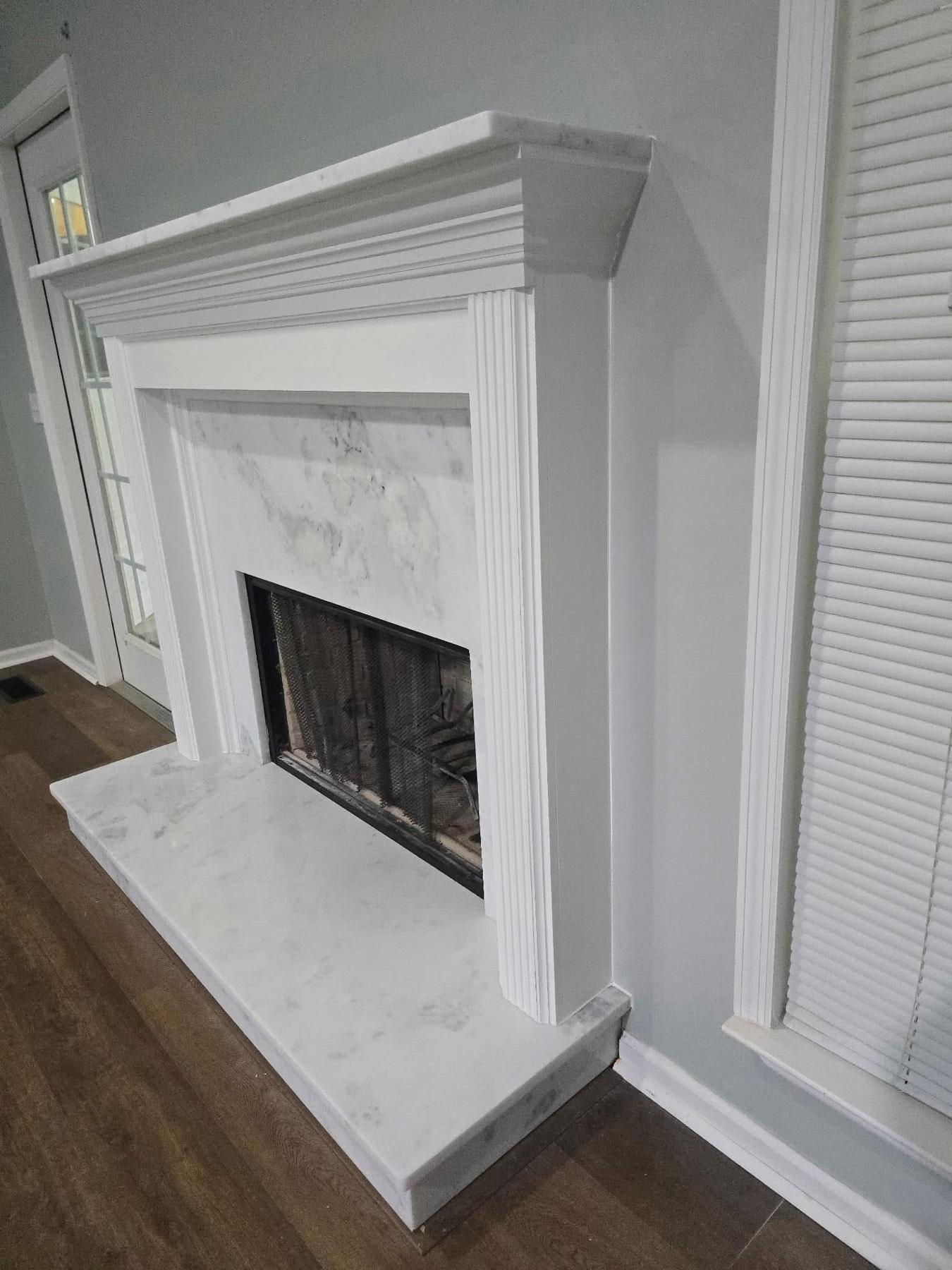 Marble surround and hearth, fluted mantel