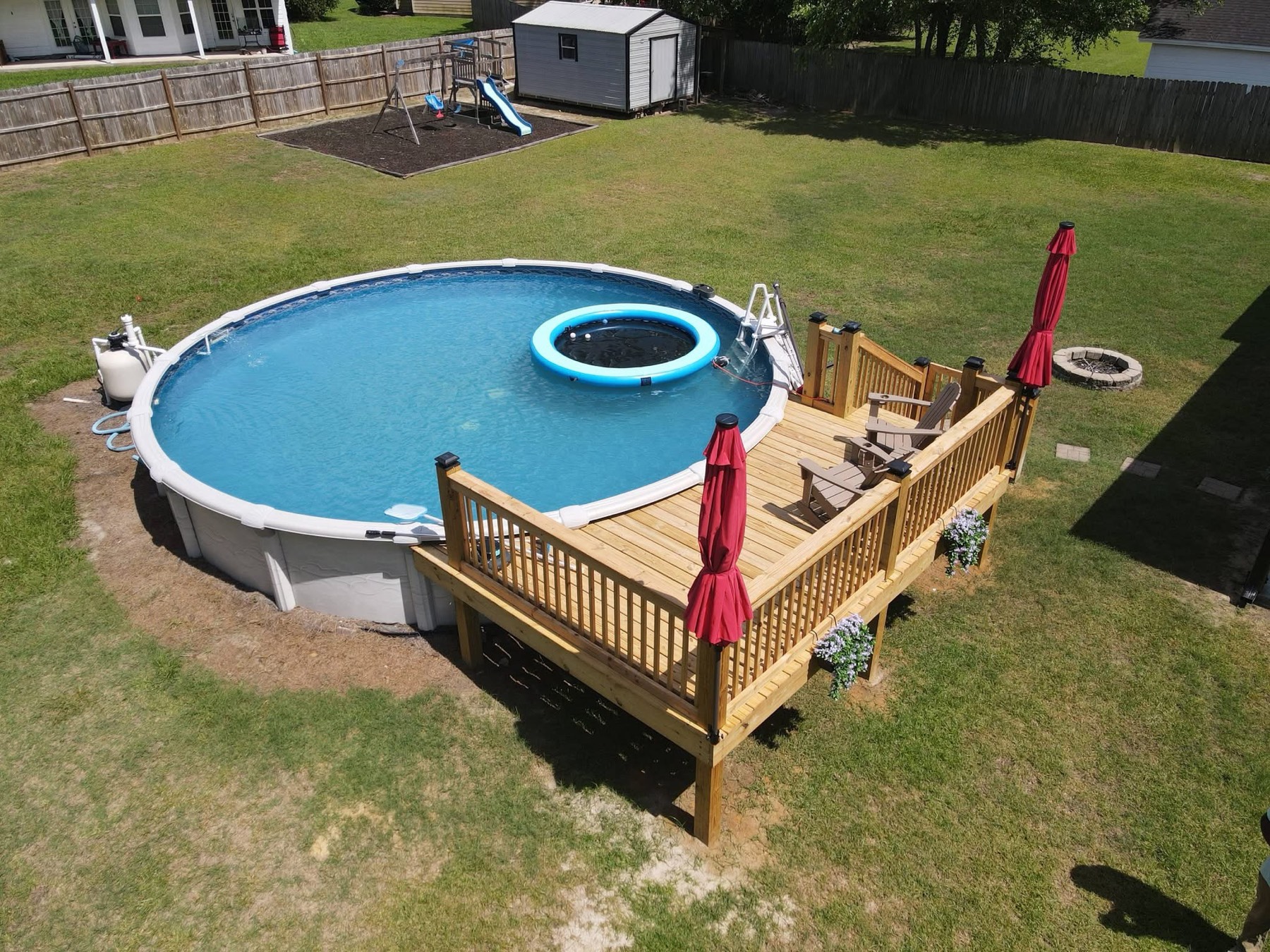 Pool deck with rail planters and umbrella posts